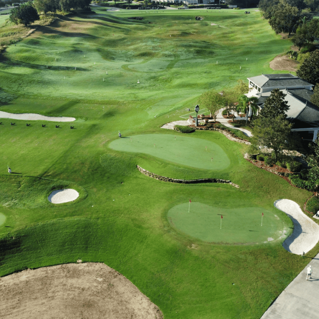 an aerial view of our private junior golf program practice facility greens and driving range